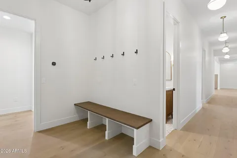 a bathroom with a sink vanity mirror and toilet