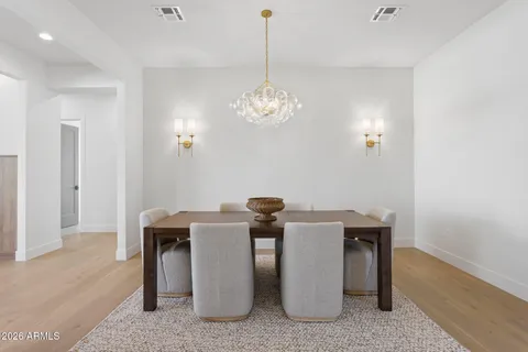 a dining room with chandelier