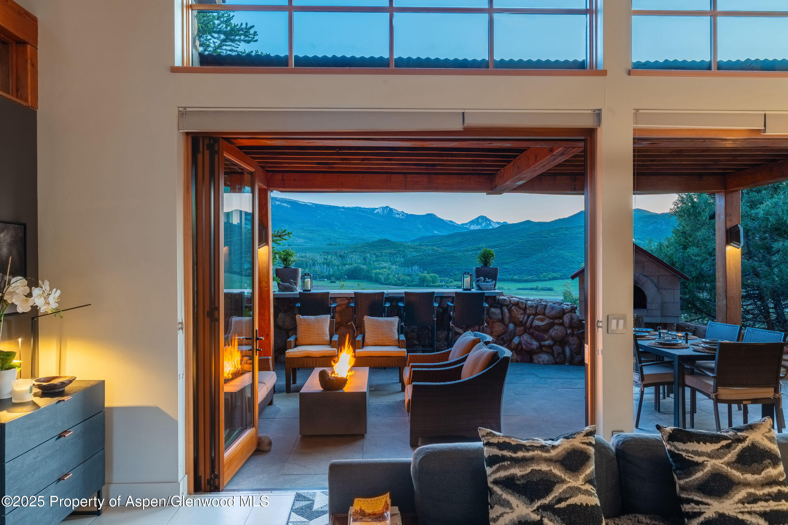 26 Bunker Loop Aspen, CO 81612 - Photo 18 of 103 a view of a livingroom with furniture and floor to ceiling window