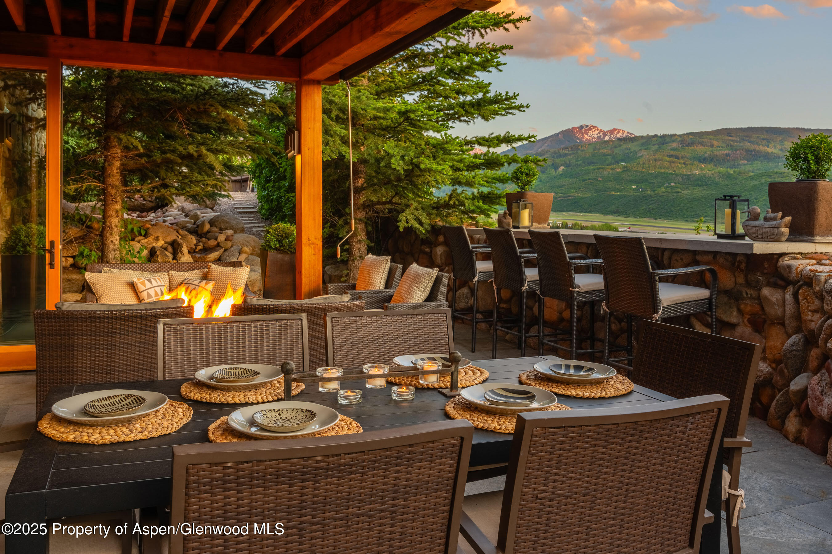26 Bunker Loop Aspen, CO 81612 - Photo 22 of 103 a table and chairs with the view of outdoor space