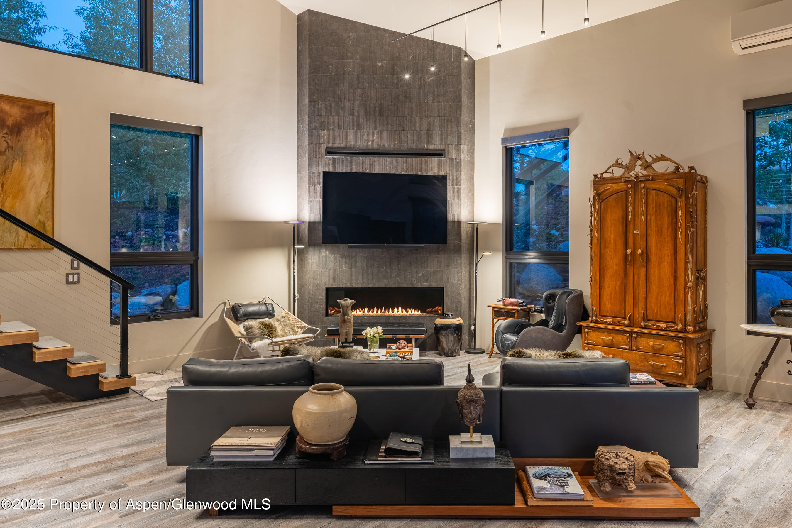 26 Bunker Loop Aspen, CO 81612 - Photo 29 of 103 a living room with furniture a fireplace and a flat screen tv