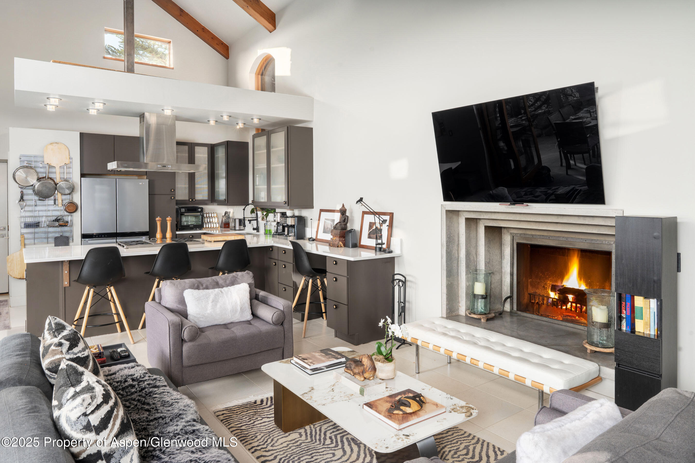 26 Bunker Loop Aspen, CO 81612 - Photo 63 of 103 a living room with furniture and a fireplace