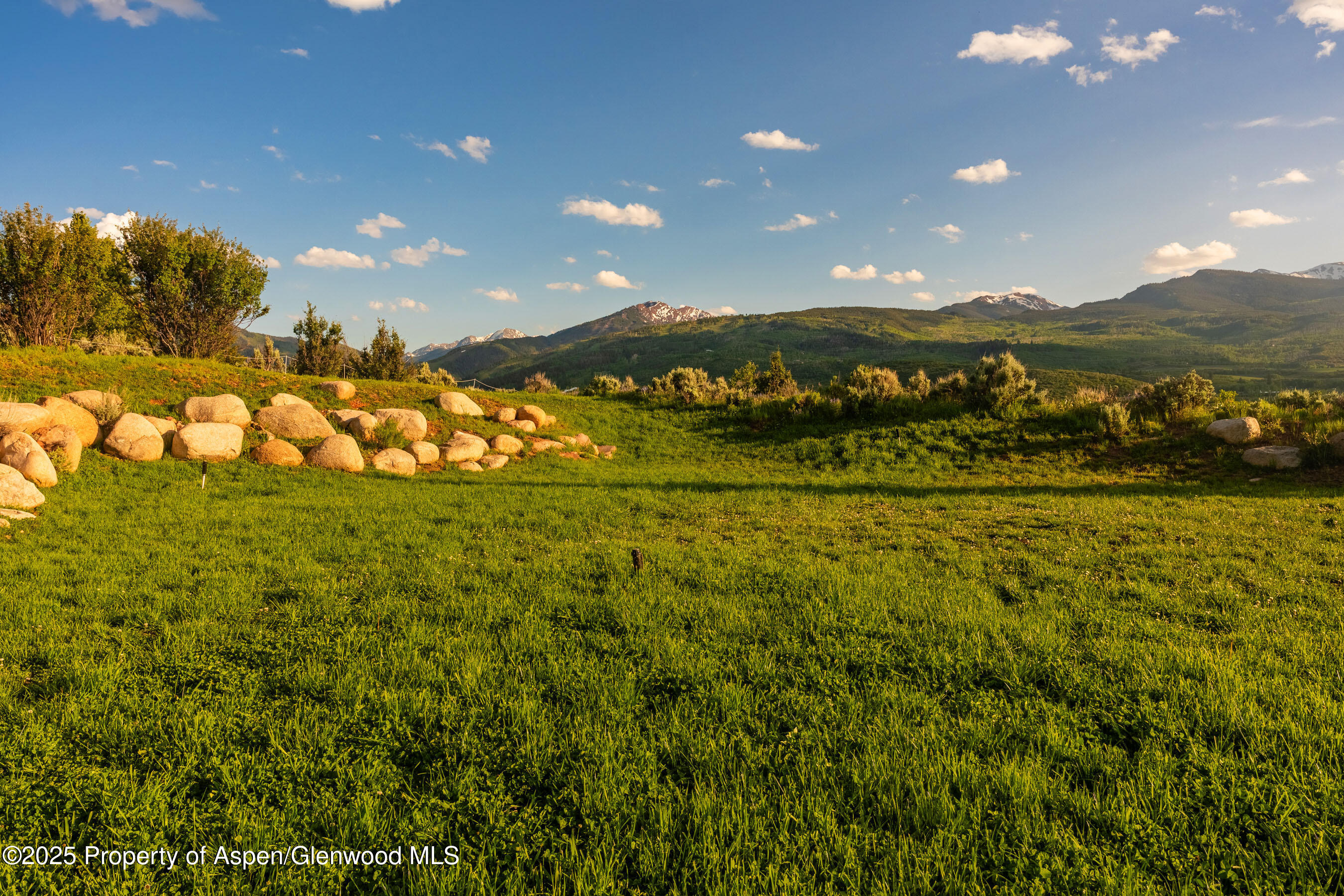 26 Bunker Loop Aspen, CO 81612 - Photo 76 of 103 a view of an ocean and a yard