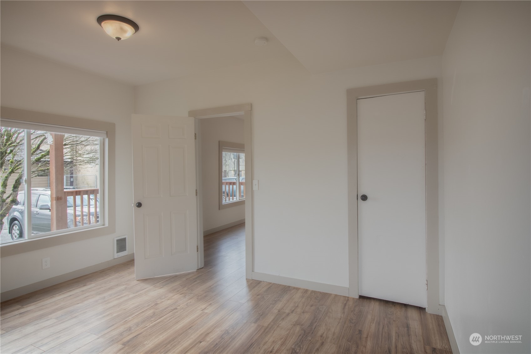 107 South M Street Aberdeen, WA 98520 - Photo 4 of 24 an empty room with wooden floor and windows