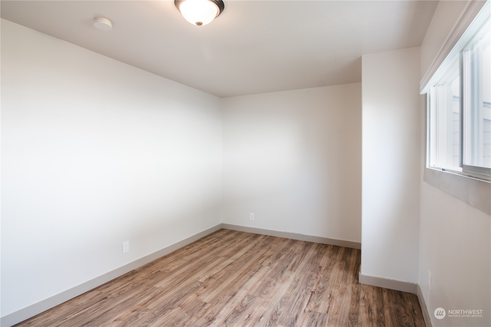 107 South M Street Aberdeen, WA 98520 - Photo 5 of 24 a view of a room with wooden floor