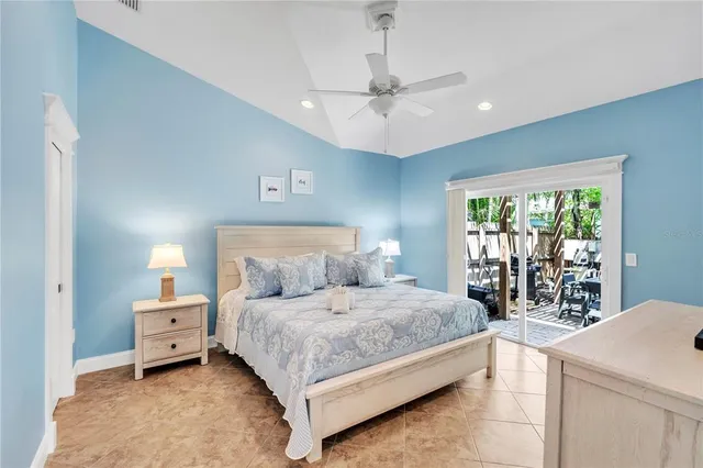 a bedroom with a large bed and a window