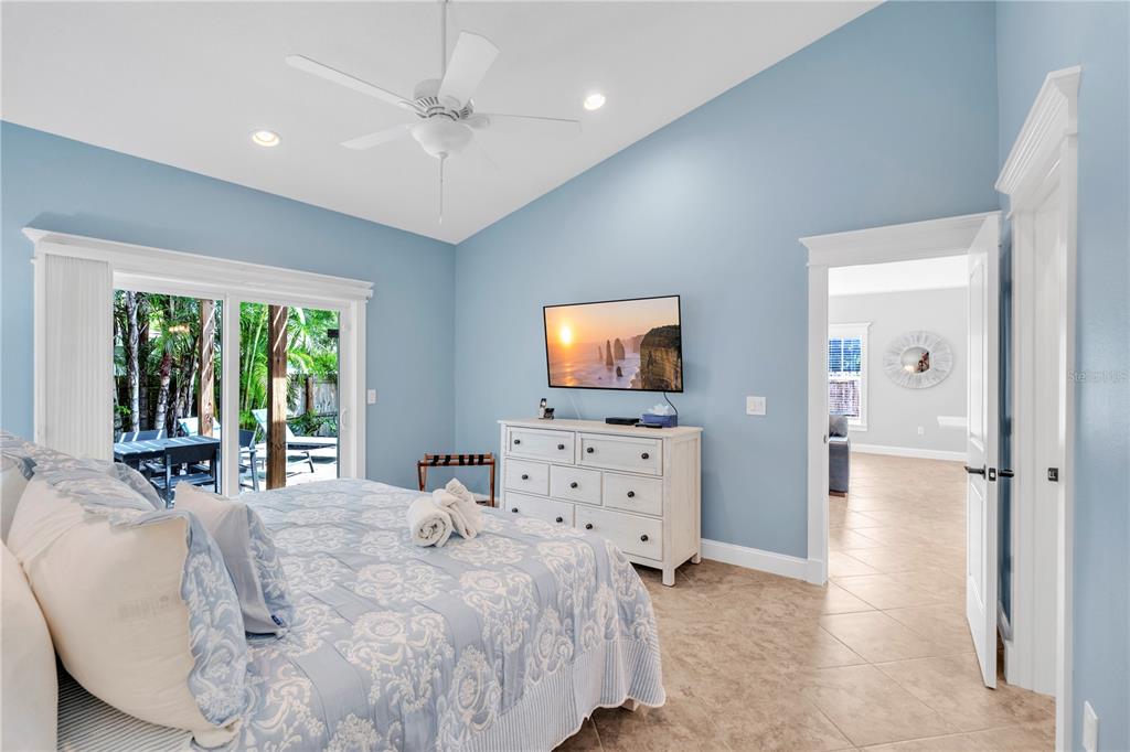 302 67th Street Holmes Beach, FL 34217 - Photo 17 of 38 a living room with furniture and a flat screen tv