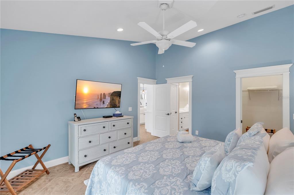 302 67th Street Holmes Beach, FL 34217 - Photo 18 of 38 a living room with furniture and a flat screen tv