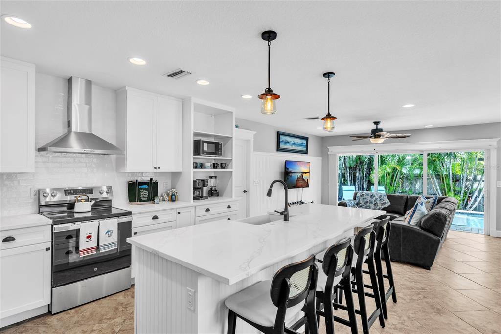 302 67th Street Holmes Beach, FL 34217 - Photo 6 of 38 a view of a dining room with furniture window and outside view