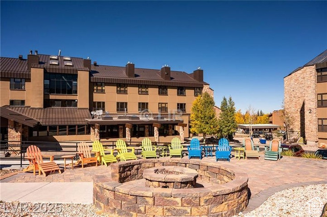 223 Hunter Ridge Drive, Unit E121 Brian Head, UT 84719 - Photo 27 of 35 View of patio with a fire pit