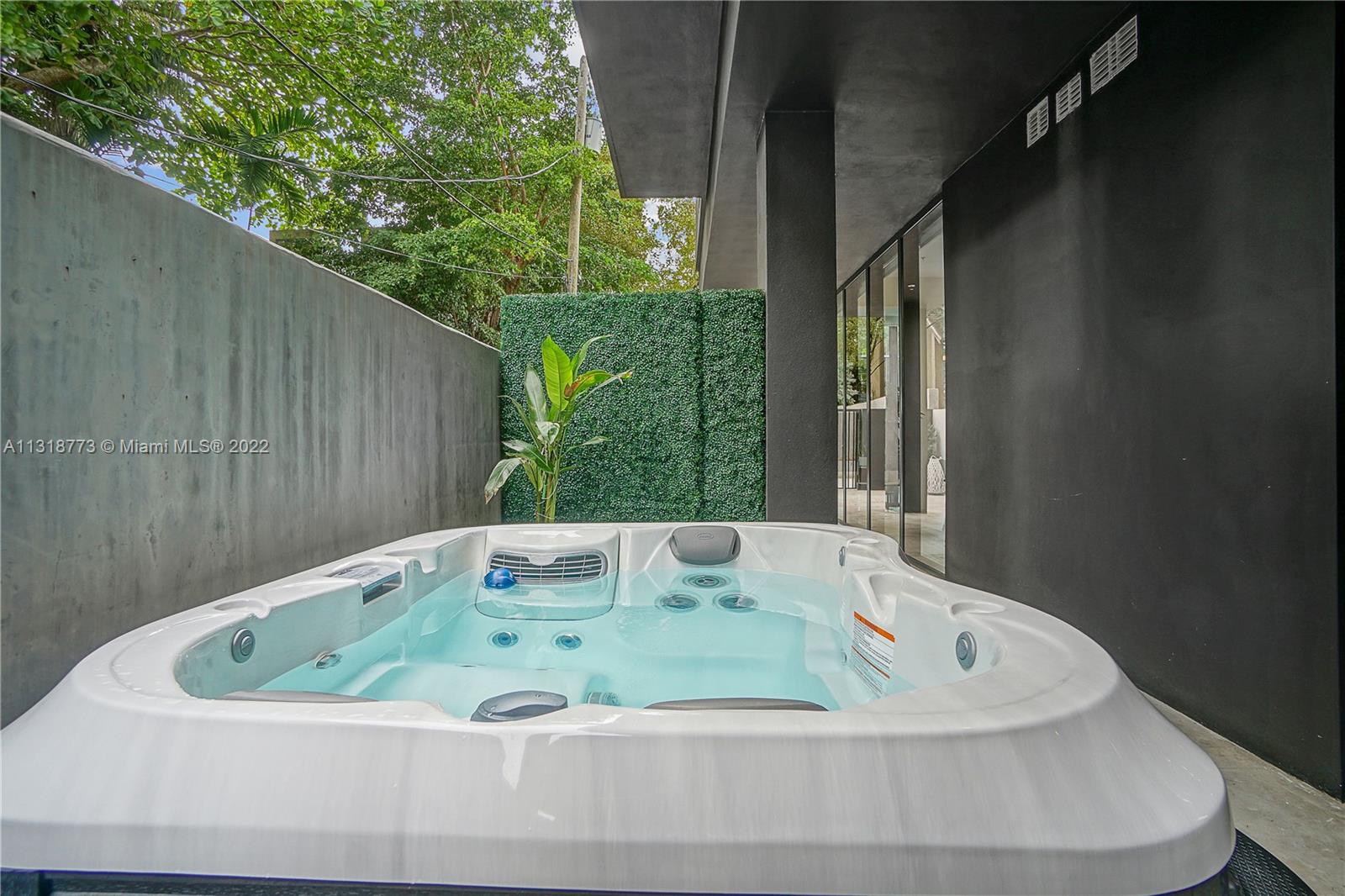 3156 Southwest 27th Avenue, Unit 101 Miami, FL 33133 - Photo 11 of 29 a view of jacuzzi and garden