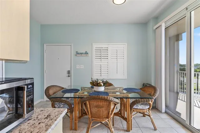 a view of a dining room with furniture and a fireplace