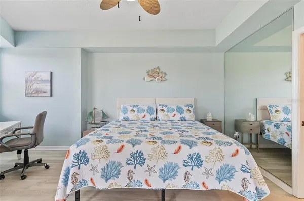 a bedroom with a bed and chair