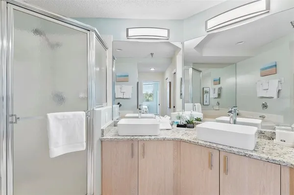 a bathroom with a double vanity sink mirror and double