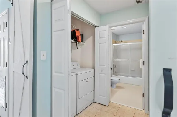 a bathroom with a shower and a sink