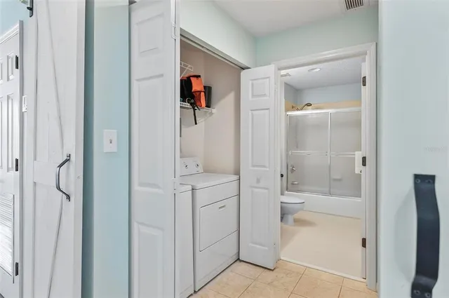 a bathroom with a shower and a sink