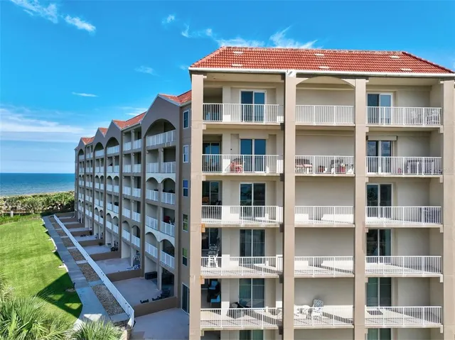 a view of a lake with a building in the background