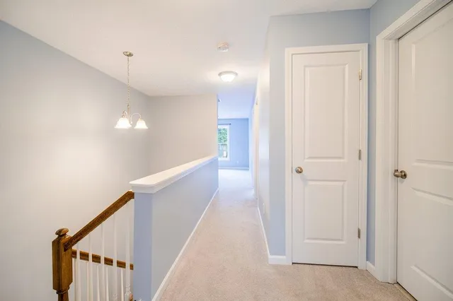 a view of a hallway with stairs