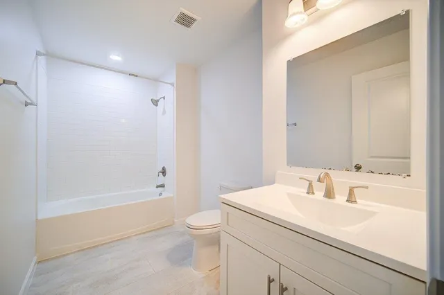 a bathroom with a sink a toilet and a bathtub