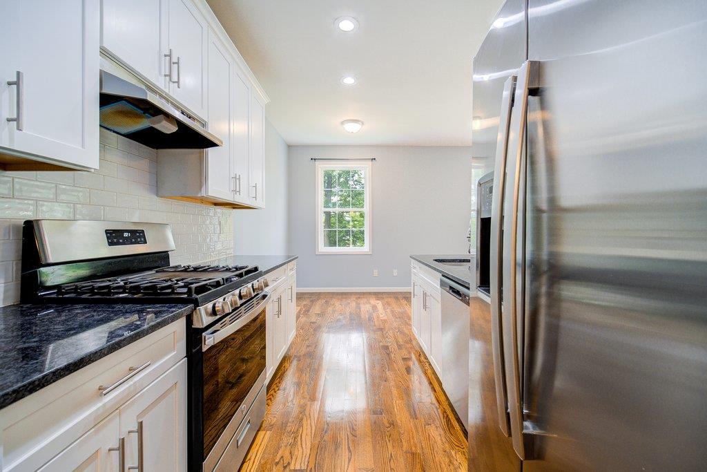 31 Pinto Road Middletown, NY 10941 - Photo 7 of 23 a kitchen with granite countertop a stove and a refrigerator