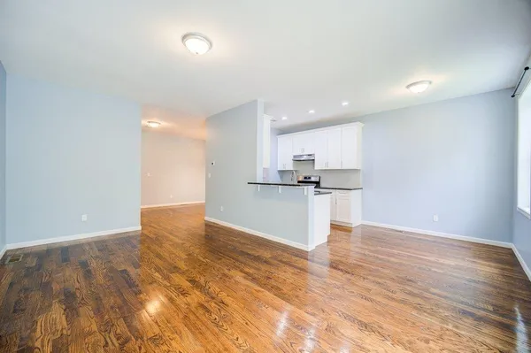 a view of kitchen with wooden floor