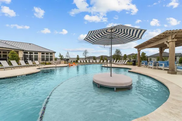 a view of a swimming pool with a patio