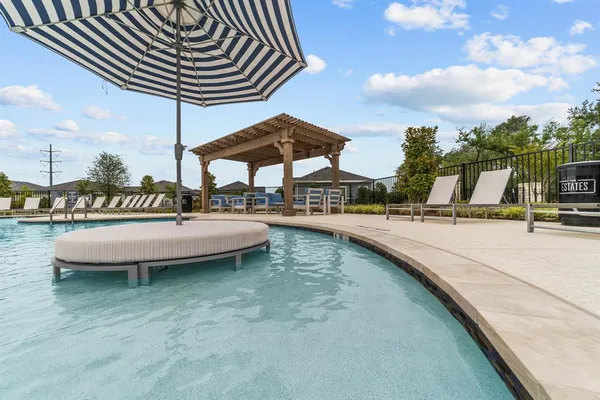 a view of swimming pool with outdoor seating