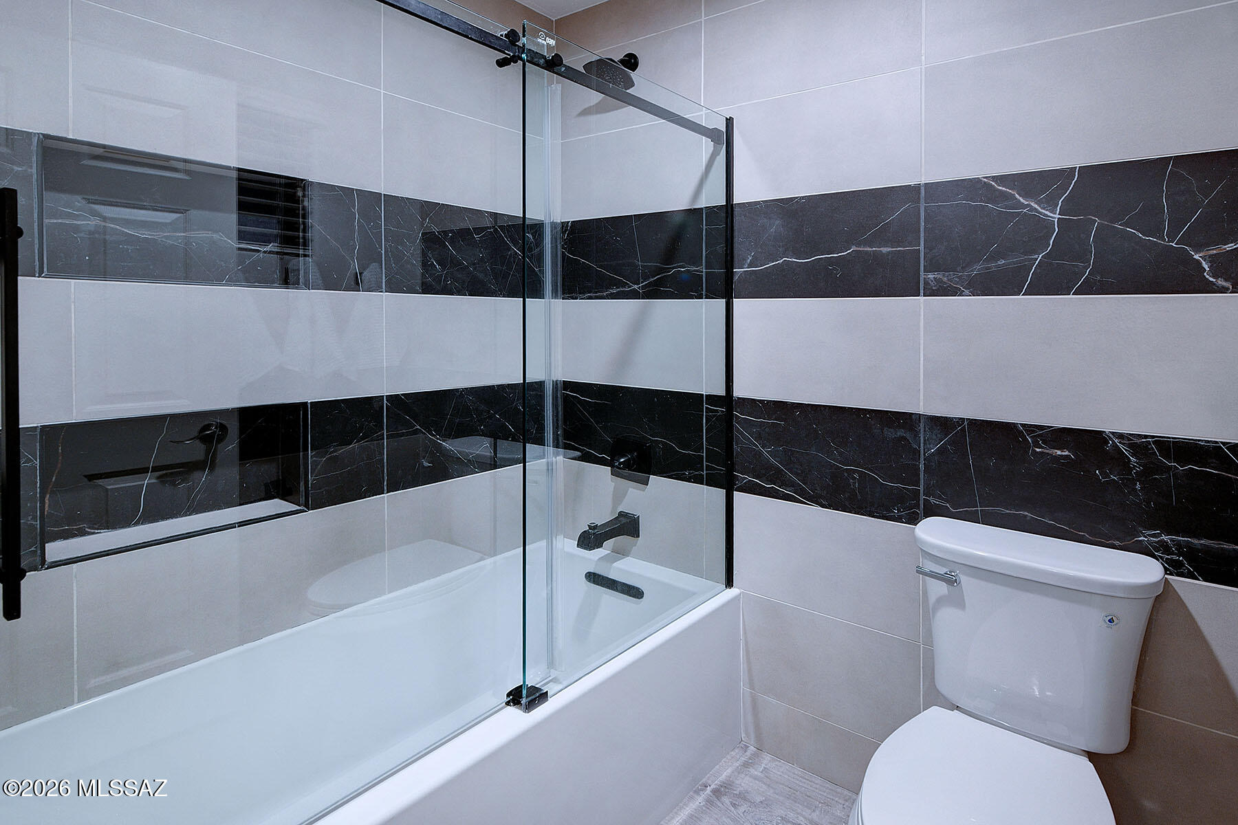 13464 North Piemonte Way Oro Valley, AZ 85755 - Photo 24 of 33 a bathroom with a shower and toilet