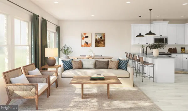 a living room with furniture a large window and a table