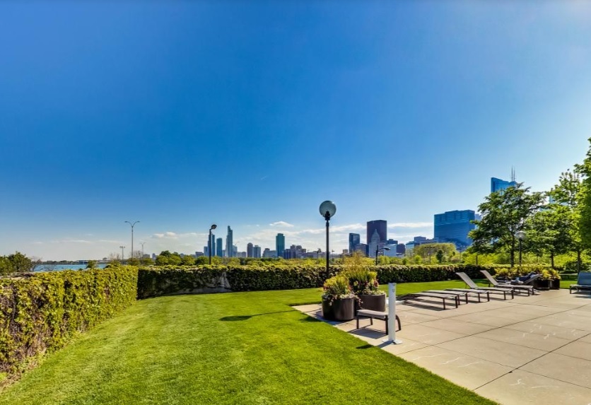 155 North Harbor Drive, Unit 2011 Chicago, IL 60601 - Photo 37 of 45 a swimming pool with outdoor seating and yard