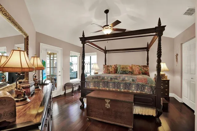 a bed room with a bed and a chandelier