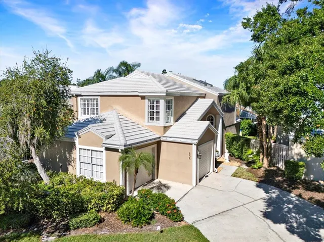 a front view of a house with a potted plant
