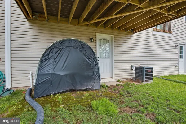 a view of a backyard with a chair