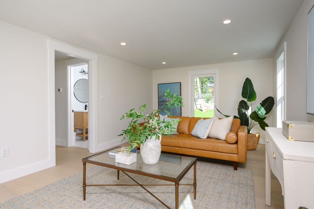 3 Patriots Way Hingham, MA 02043 - Photo 19 of 39 a living room with furniture and a potted plant
