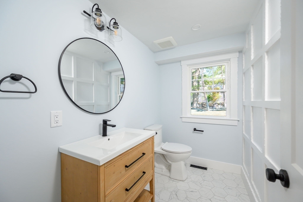 3 Patriots Way Hingham, MA 02043 - Photo 20 of 39 a bathroom with a sink a toilet and a mirror