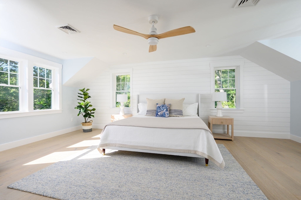 3 Patriots Way Hingham, MA 02043 - Photo 27 of 39 a spacious bedroom with a bed and a window