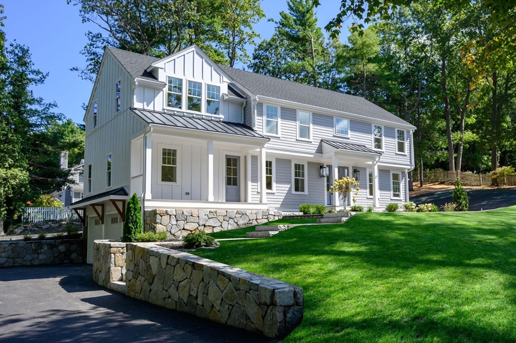 3 Patriots Way Hingham, MA 02043 - Photo 3 of 39 a front view of a house with a garden