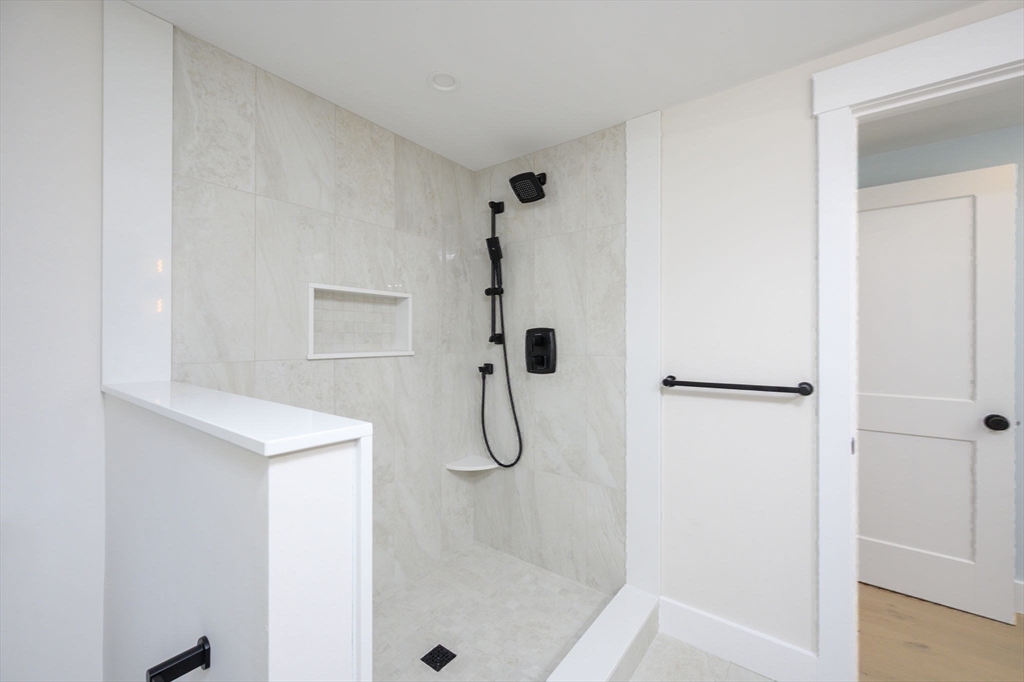 3 Patriots Way Hingham, MA 02043 - Photo 32 of 39 a bathroom with a glass shower door