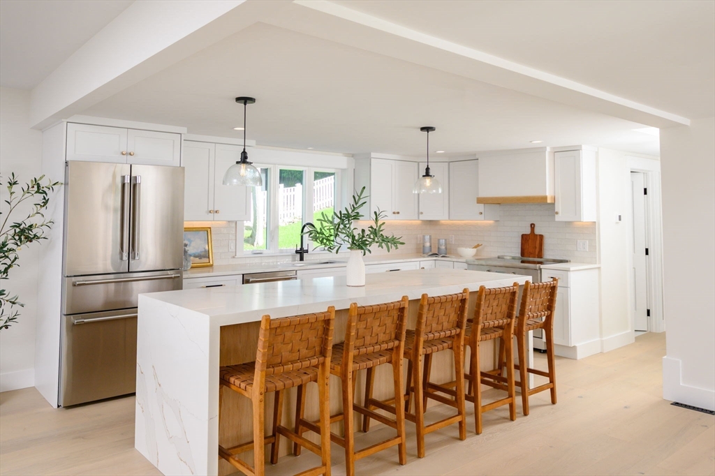 3 Patriots Way Hingham, MA 02043 - Photo 6 of 39 a kitchen with stainless steel appliances granite countertop a refrigerator and a stove top oven