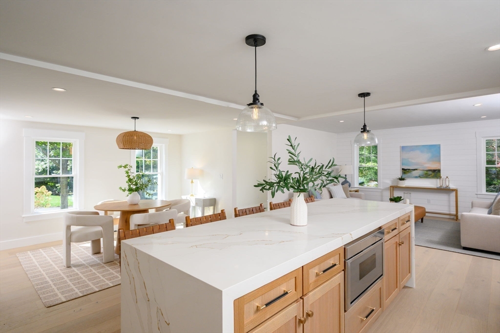 3 Patriots Way Hingham, MA 02043 - Photo 9 of 39 a kitchen with a table and chairs