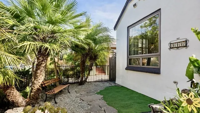 a backyard of a house with seating space