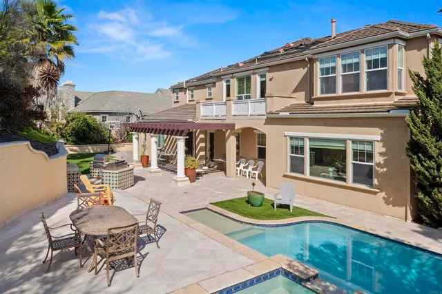 a living room with furniture a window and a flat screen tv