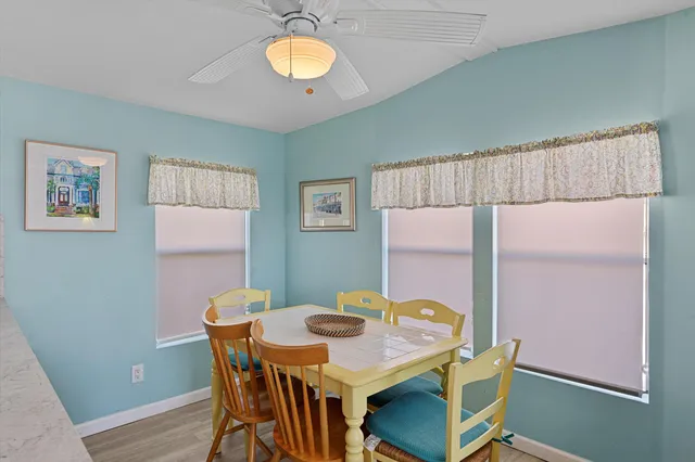 a view of a dining table and chairs in a room
