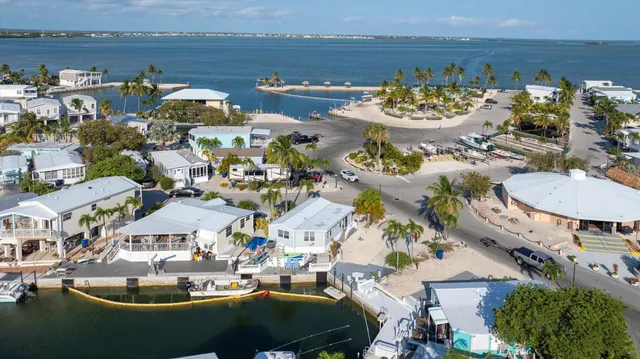 a view of a lake with couches chairs