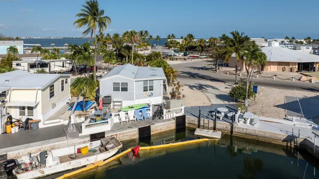 a view of a chairs and table in a patio