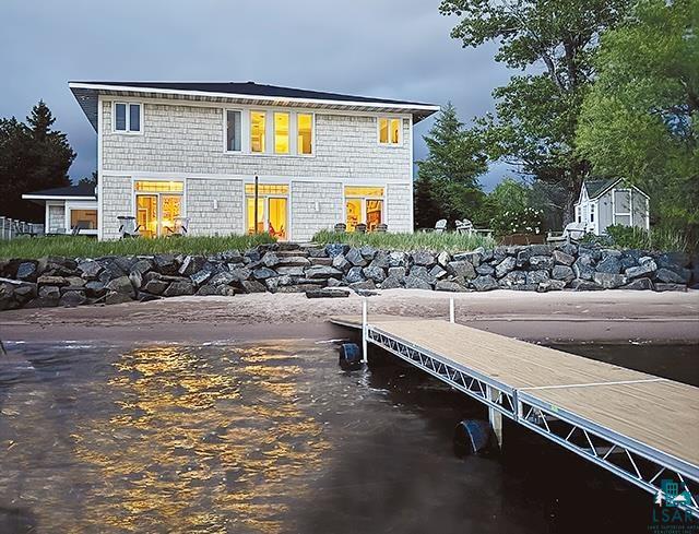 Rear view of house with a water view