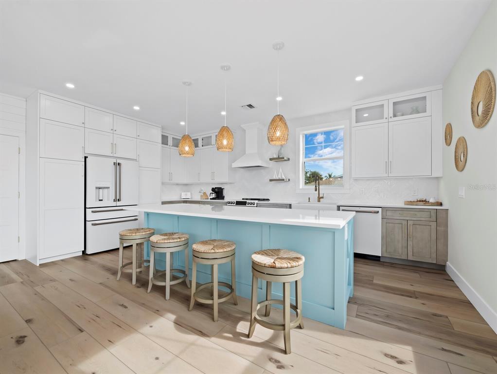 630 Companion Way Longboat Key, FL 34228 - Photo 13 of 66 a kitchen with a sink cabinets and wooden floor