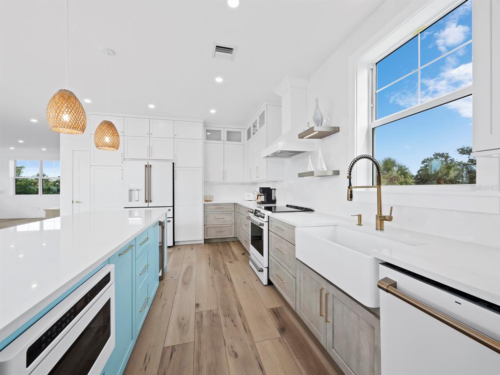 630 Companion Way Longboat Key, FL 34228 - Photo 14 of 66 a kitchen with a sink a counter space cabinets and stainless steel appliances