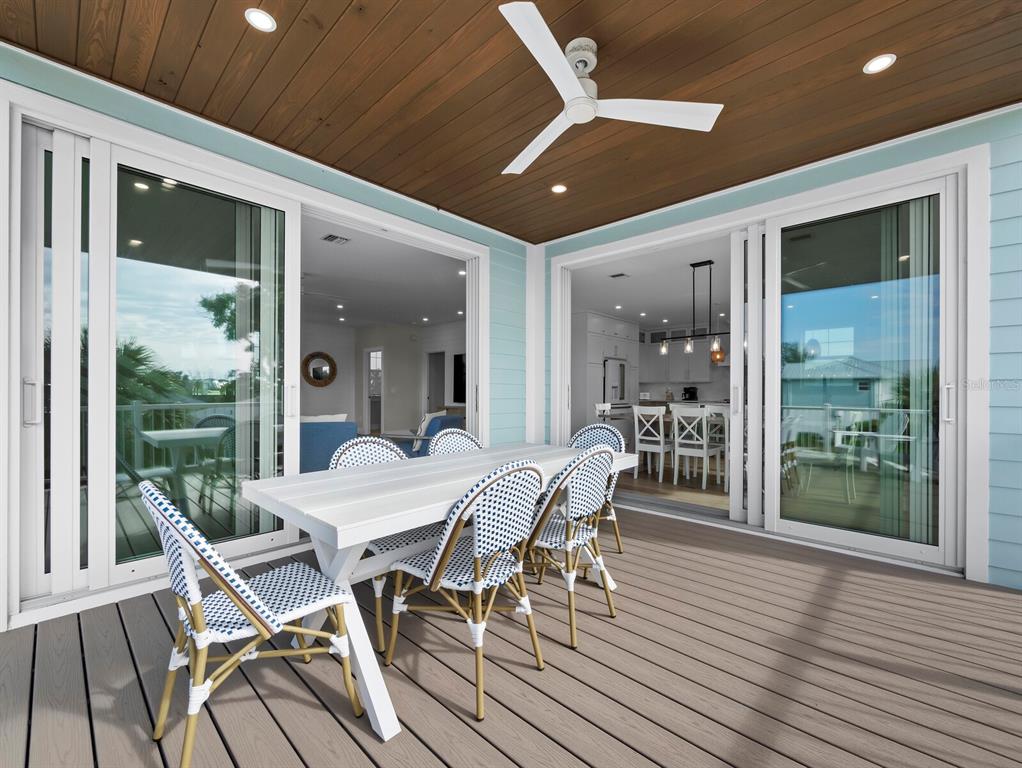 630 Companion Way Longboat Key, FL 34228 - Photo 18 of 66 a view of a dining room with furniture window and wooden floor