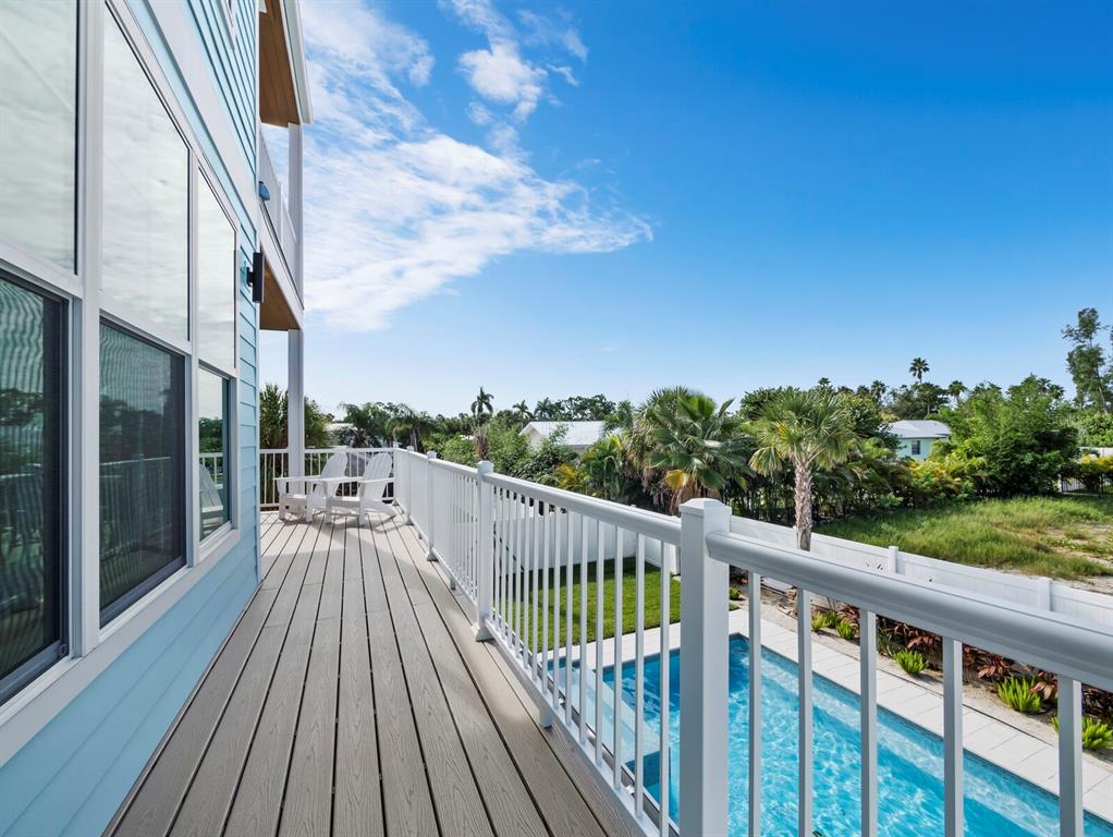 630 Companion Way Longboat Key, FL 34228 - Photo 20 of 66 a view of a balcony with wooden floor